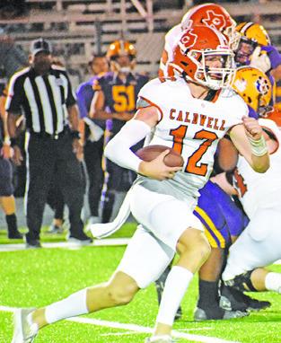 BOONE TURNER of Caldwell carries the ball for Caldwell against La Grange prior to his injury. -- Tribune photo by Roy Sanders