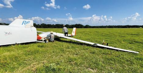 THE PILOT OF THIS glider made an emergency landing on Aug. 5 in this field off County Road 130. He was not injured.