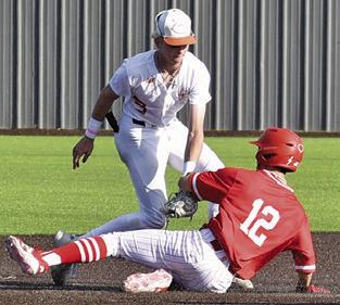 RYAN SEE of Caldwell tags this Salado base runner in the round two playoff game. Tribune photo by Roy Sanders