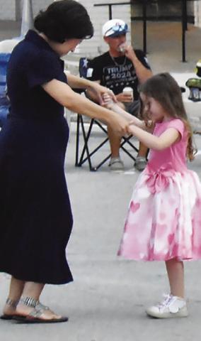 DANCERS ENJOYED the Saturday, July 13, downtown concert. The People’s Choice Band performed. Tribune photo by Roy Sanders
