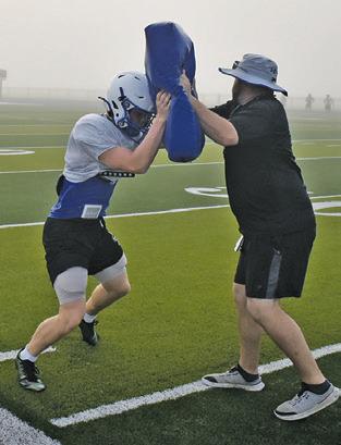 SNOOK PLAYERS work on fundamentals during practice getting ready for their Friday, Aug. 28 opener against Hull-Daisetta.