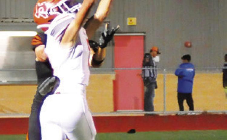 CALDWELL’S DYLAN Carter intercepts a pass against Smithville last Friday in Smithville. -- Tribune photo by Denise Squier