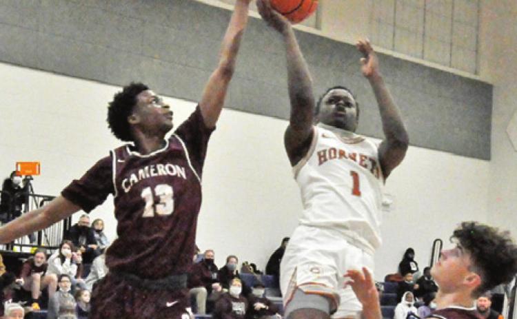 JAMAR HEWITT OF Caldwell shoots against Cameron. The Hornets lost at home 65-52. -- Tribune photo by Roy Sanders