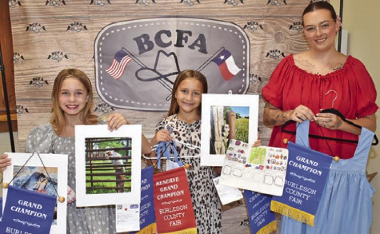 HATTIE HERRMANN, left, won grand champion for fine art photography, portrait, knitting, jewelry and sewing; Heidi Herrmann, middle, won grand champion for art; and Madalyn Jennings, right, won grand champion for adult clothing.