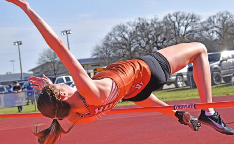 CALDWELL’S RYAN FERGUSON jumps for a bronze medal in the high jump at last week’s Koppers Relays. -- Tribune photo by Roy Sanders