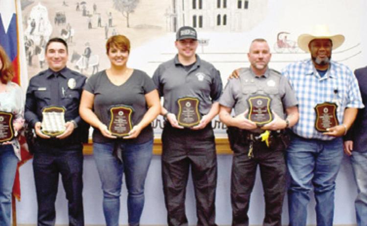AWARD WINNERS INCLUDED, from left, Elizabeth Rinck, Christine Labertew, Justin Like, Meredith Fletcher, Dakota Woodruff, Jim Loeblein, Sheldon Smith, Lee Jay Griffin and Charles Sleeth. They were recognized on Oct. 5 during the Law Enforcement Appreciation Banquet.