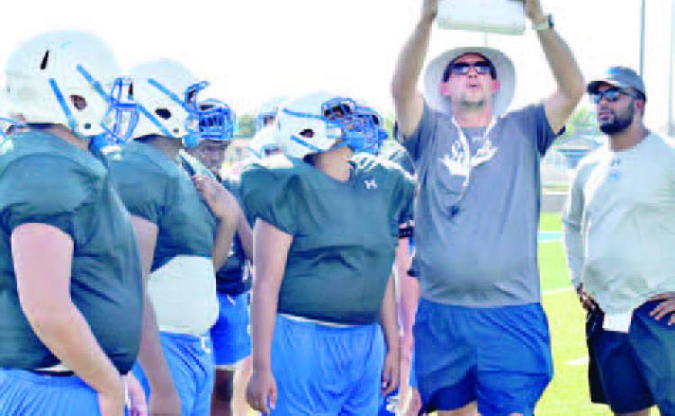 SNOOK HEAD COACH Dylan Conway goes over these plays with the Snook Bluejays during the Monday, Aug. 15, practice.