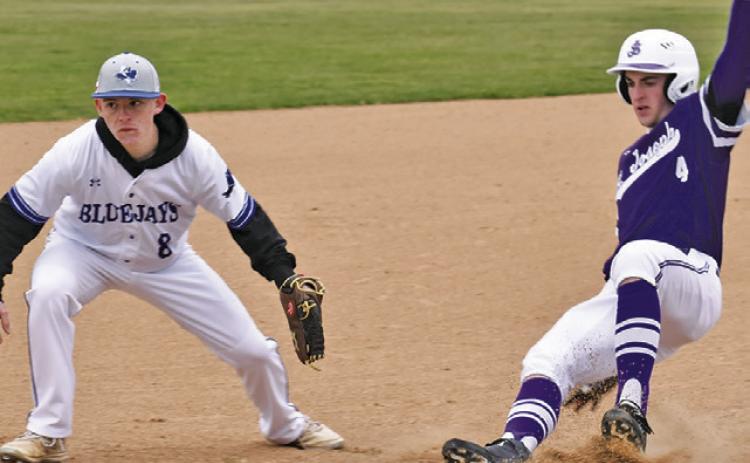 WYATT LOPEZ OF SNOOK is a third base as this St. Joseph baserunner approaches. Tribune photo by Roy Sanders