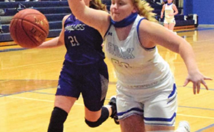 SHELBY HUDDLESTON reaches to keep the ball in bounds during the Lady Jays’ game against Douglass last Friday night.