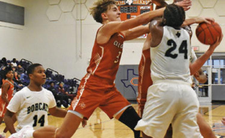 DYLAN CHAPMAN OF Caldwell fights for the ball against Hempstead. Tribune photo by Roy Sanders