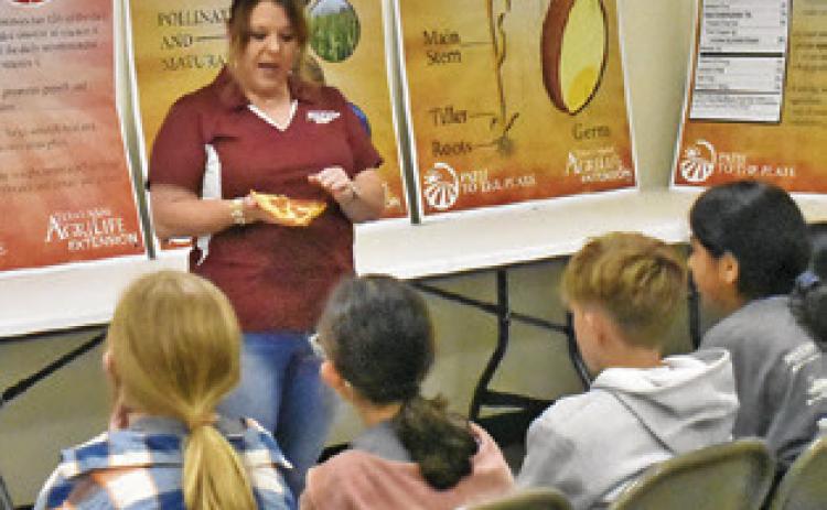 BURLESON COUNTY AGRILIFE Extension Agent Holly Narro addresses these fifth-graders on May 7 at the Burleson County Ag &amp; Health Safety Day held at the county expo center.