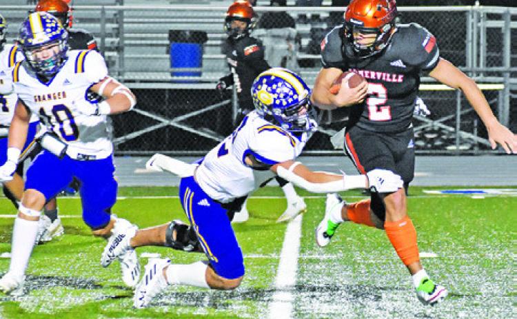 IAN TEAGUE OF Somerville carries the ball against Granger in the bi-district playoff game. -- Tribune photo by Roy Sanders