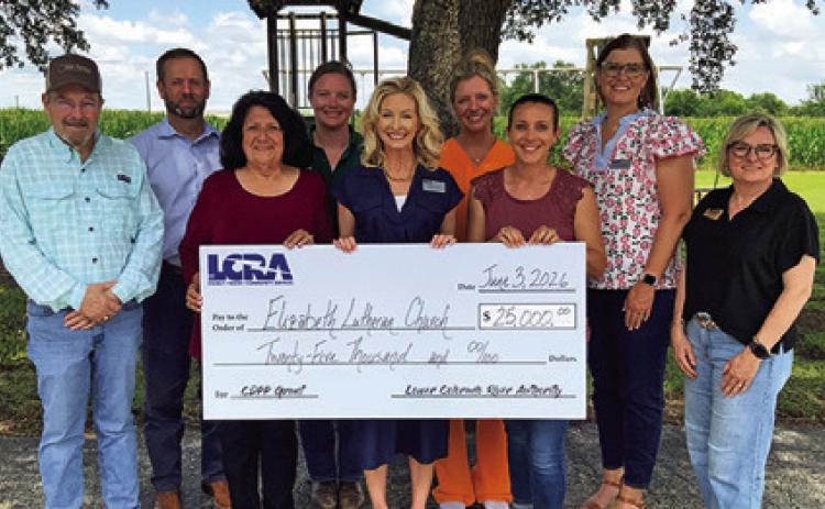 MEMBERS OF THE ELIZABETH Lutheran Church in Caldwell’s playground committee and LCRA gather to celebrate the $25,000 community grant. Photo courtesy of LCRA