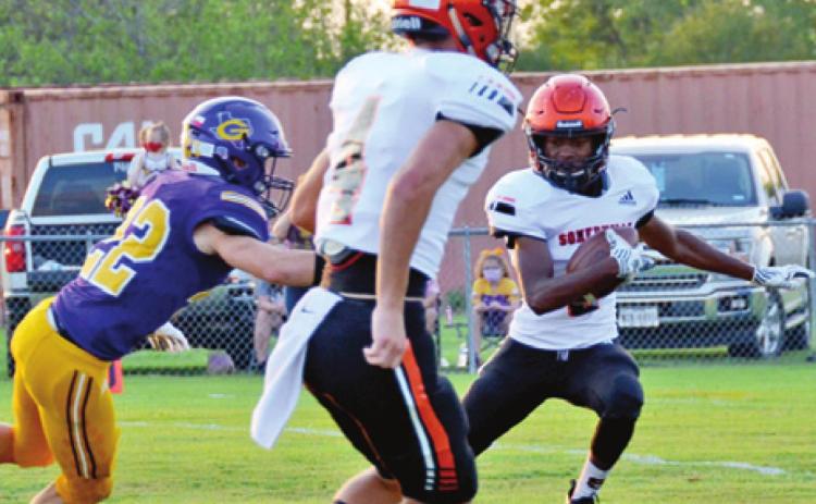 SOMERVILLE’S VERKOBE WOODBERRY breaks free against Grangers last Friday. Also pictured is Johnny Legg, center.