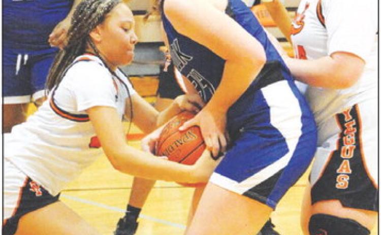 SNOOK’S ALEXIS MACIK AND Somerville’s Gabby Jackson fight for possession of the ball during the Snook-Somerville game last Friday night.