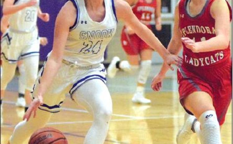 SNOOK’S JAYCIE BRISCO drives the ball down the court after a rebound during the Lady Jays’ win over Splendora Thursday night during the Aggieland Invitational. -- Tribune photo by Denise Hornaday