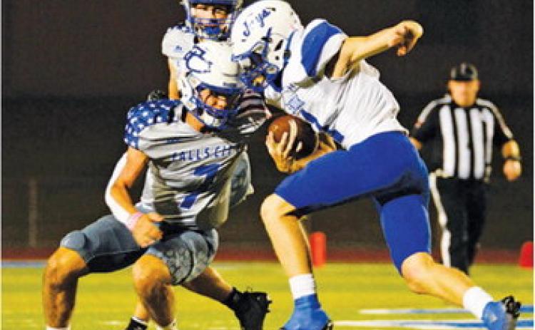 SNOOK’S LIAM ZEQUERIA carries the ball against Falls City in last Friday’s road game. -- Photo courtesy of Marion Laskowski
