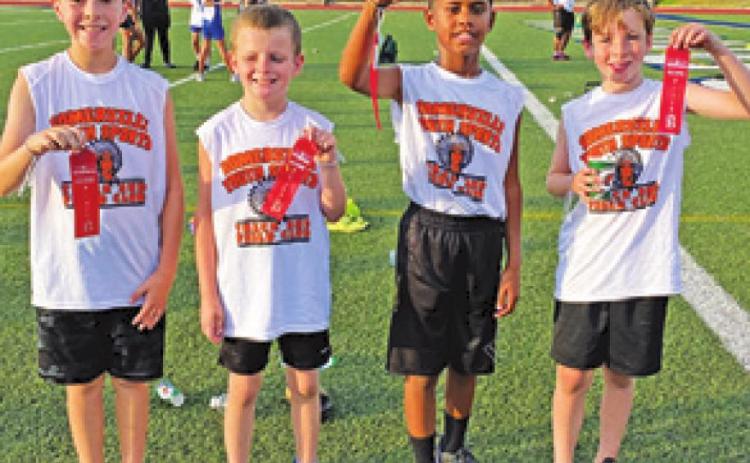 SOMERVILLE YOUTH SPORTS competed at the Bryan Thunderbolts Invitational Track Meet on June 30. Pictured are, from left, Jaxton Groce, Jaxson Schoppe, Elijah Pleasant and Conner Richardson.