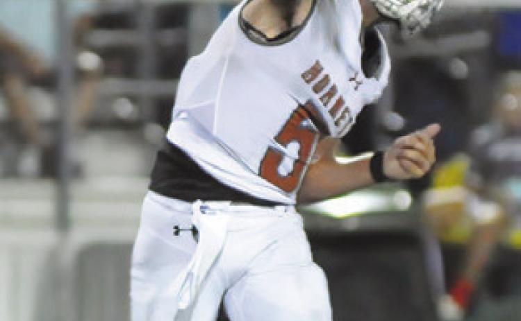 JOHN FRYREAR passes the ball against Robinson. Tribune photo by Denise Squier