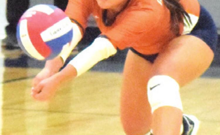 MACY NARRO returns a serve by a Madisonville player, bumping the ball to the Caldwell setter. -- Tribune photo by Denise Squier