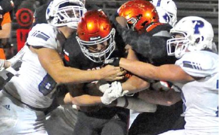 SOMERVILLE’S JEREMIAH TEAGUE fights for extra yardage against the Peaster defense last Friday in Somerville. The Yeguas lost their finale and finished 2-8. -- Tribune photo by Roy Sanders
