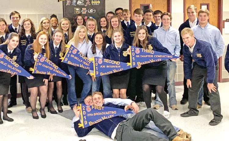 CALDWELL HIGH SCHOOL FFA students hold these banners after placing well at the District Leadership Event contests at A&amp;M Consolidated High School. They are advancing to the Area XII competition on Nov. 23 in Georgetown.