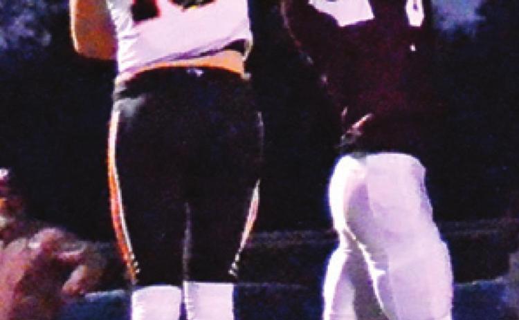 SOMERVILLE’S HUNTER David breaks up this Iola pass. -- Tribune photo by Roy Sanders