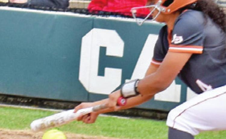 CALDWELL’S ALIYAH VELA bats during Caldwell-Bellville game at the annual SWARM Softball Tournament last Saturday.