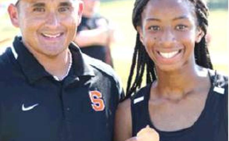 SOMERVILLE’S RAMAYA Carter finished fifth in the girls junior varsity division at the Lexington Small School Showdown Cross Country Meet on Saturday, Sept. 7. She is pictured with her coach Billy Ramey.