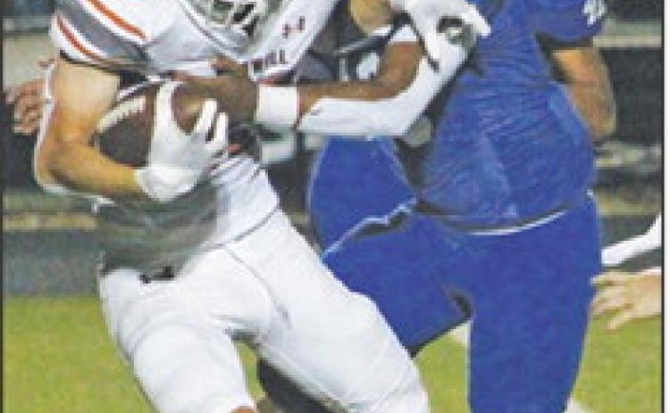 BRAXTON FRITCHER fights for extra yardage against Jarrell last Friday in Jarrell. -- Tribune photo by Kim Hutcheson