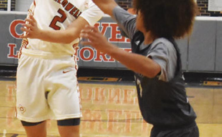 NATHAN HERMES passes the ball against Bryan JV in the round one game of the Kolache Capital Tournament in Caldwell. Tribune photo by Roy Sanders