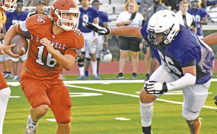 KEIFER ELLIS OF Caldwell carries the ball against Navasota in the Aug. 18 scrimmage. -- Tribune photo by Roy Sanders
