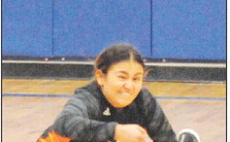 VIVIANNA MUNOZ dives to keep the ball off the floor during Somerville’s win over Dime Box. -- Tribune photo by Denise Squier