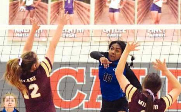 SNOOK’S JAIVAN STRINGFELLOW gets one of her 12 kills during the Lady Jays’ bi-district win over Milano last Thursday night in Caldwell. Also pictured are Snook’s Kamree Walker and Milano’s Montgomery Popham and Toni Meyer. -- Tribune photo by Denise Hornaday
