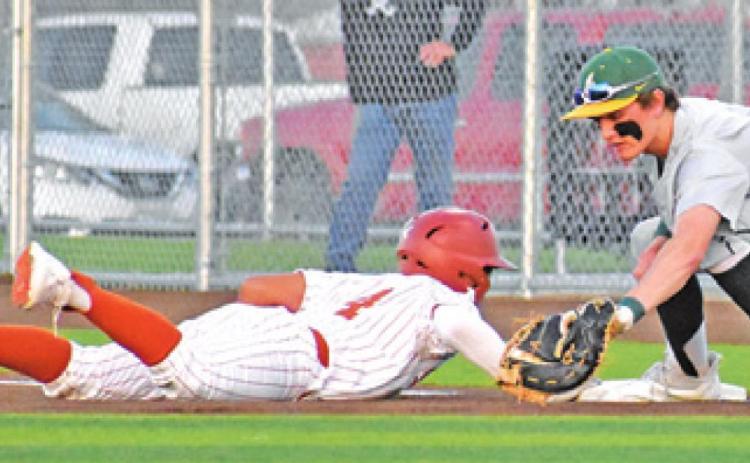 KAIN SANCHEZ GETS back on first base and is safe against Little River-Academy. -- Tribune photo by Roy Sanders