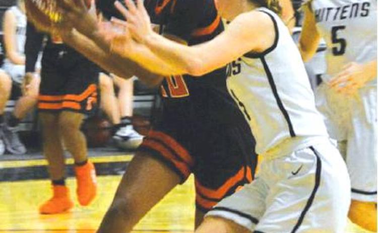 SOMERVILLE’S XADRIA MARTIN drives to the hoop with Moulton applying some pressure. Moulton edged the Lady Yeguas in their season opener 34-32. -- Photo courtesy of the Shiner Gazette