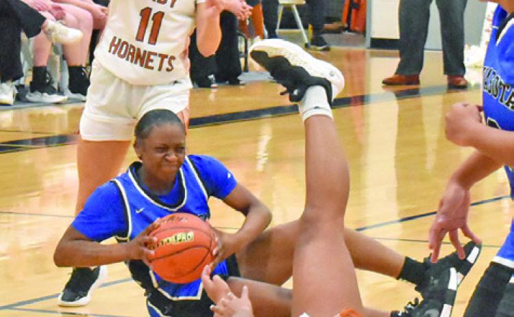 SEVERAL LADY HORNETS scramble for possession with a Navasota player during Caldwell’s 48-21 loss to Navasota last Friday night. Tribune photo by Roy Sanders
