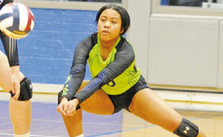 ALANA STRINGFELLOW dives to bump the ball during the Snook-Fayetteville match last Friday. -- Tribune photo by Denise Squier