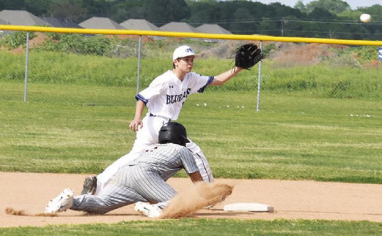 SNOOK’S GABRIEL LaCAZE prepares to catch the ball as Ian Teague slides to second base.