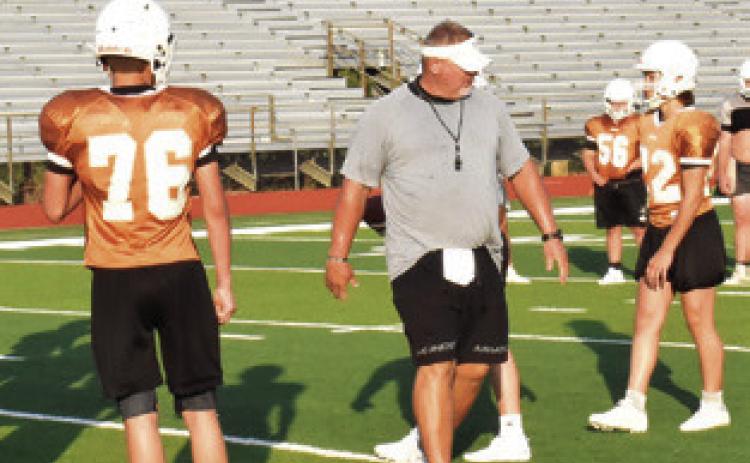 CALDWELL HEAD COACH Sean Witherwax coaches his team during this early practice session. Tribune photo by Roy Sanders