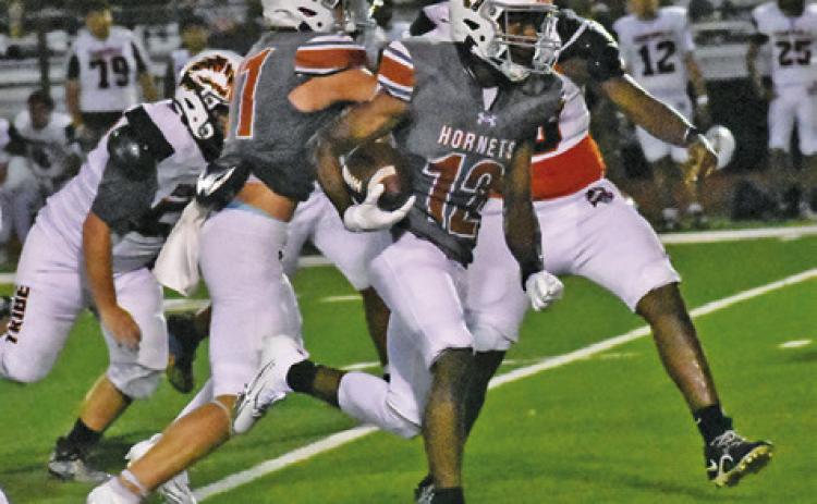 CALDWELL’S DEJUAN MATHIS carries the ball against Somerville. Tribune photo by Roy Sanders