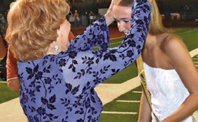 CHS ALUMNA STEPHINA DiDonato, Class of 1951, crowns this year’s CHS Homecoming Queen, Lucy Ferguson. Tribune photo by Roy Sanders