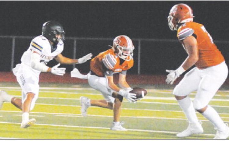 CADEN SCHLUENS MAKES a catch for Caldwell in the homecoming game against Lexington. -- Tribune photo by Denise Squier