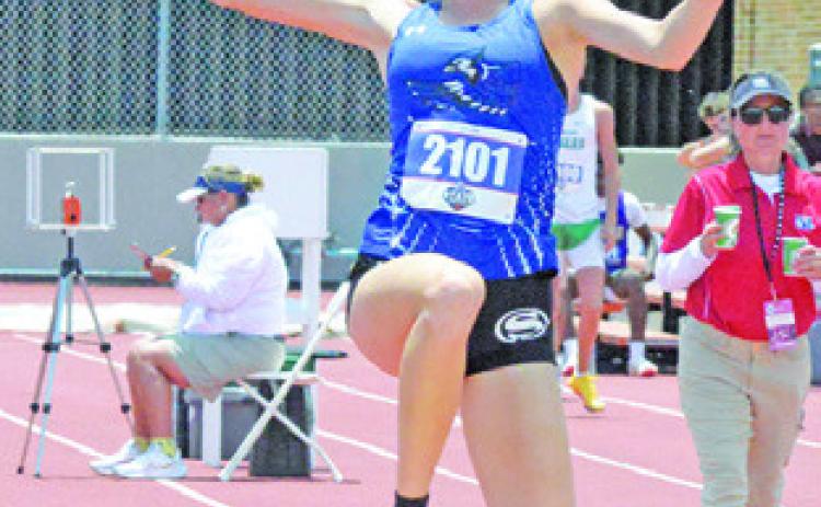 SNOOK’S DAKOTA KIENOW competes in the Class 2A girls triple jump on Friday during the UIL State Track &amp; Field Meet. Tribune photo by Denise Squier