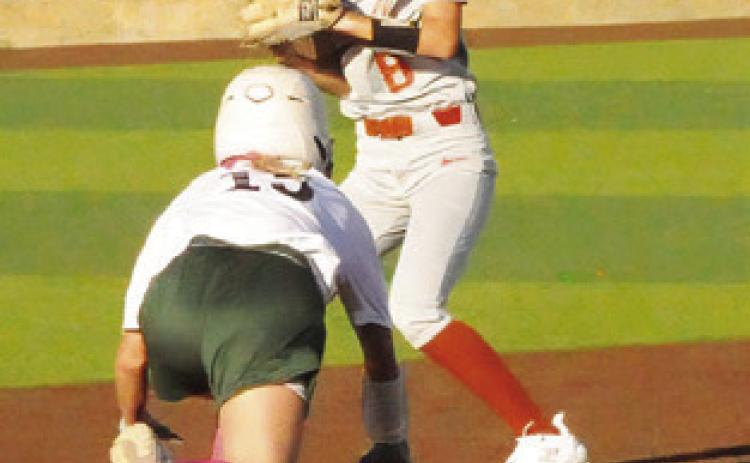 JILLIAN VYKUKAL steps on the bag for an out and checks the runner at first during the Caldwell- Lexington game during this year’s Lady Hornet Softball Tournament.