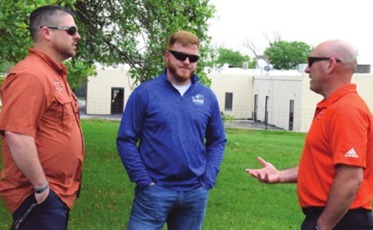 THE COUNTY’S ATHLETIC directors met last week at The Tribune to discuss the UIL’s decision to suspend all contests, practices, rehearsals and workouts until further notice. Pictured, from left, are Matt Langley, Caldwell ISD athletic director, Boone Patterson, Snook ISD athletic director, and Cal Neatherlin, Somerville ISD athletic director.