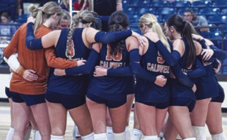 THE LADY HORNETS HUDDLE at the Leon Tournament last week.
