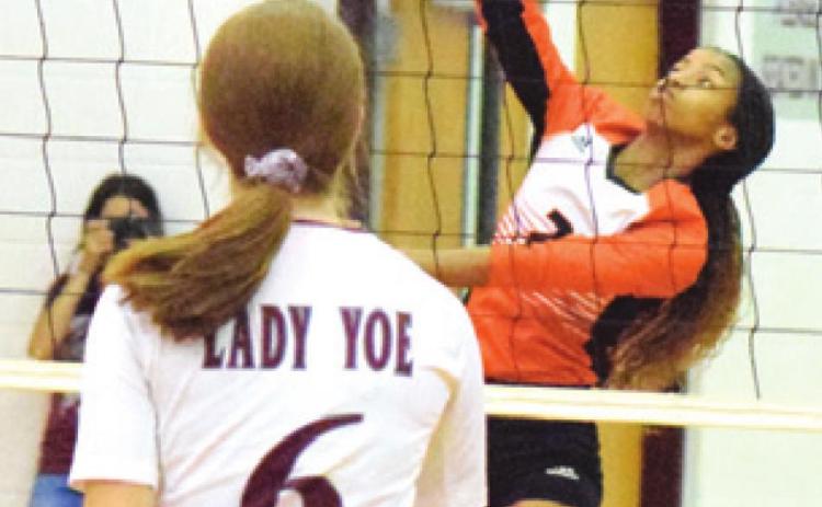 RA’MAYA CARTER hits the ball over the net during Somerville’s match against Cameron Yoe. -- Tribune photo by Denise Hornaday
