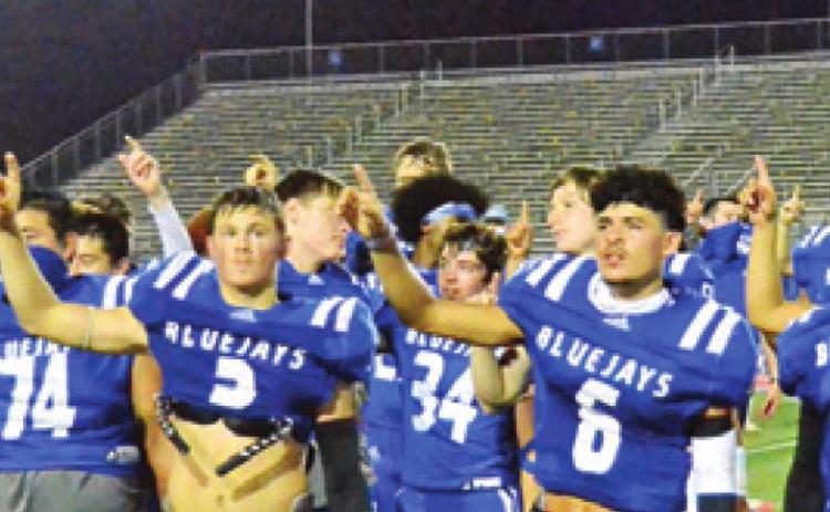 THE SNOOK BLUEJAYS CELEBRATE after winning the bi-district game over Miles at Austin Westlake High School. Snook faces Yorktown next in the Area playoff.