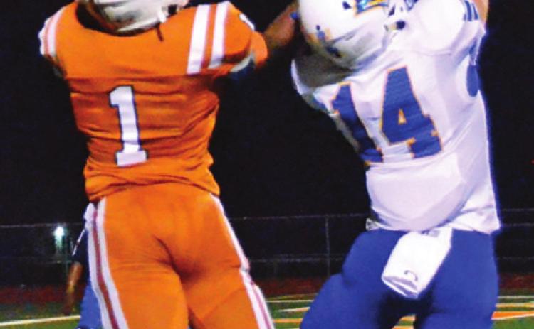 CALDWELL’S JAMAR HEWITT goes for the ball last Friday against Lago Vista. The Hornets fell to the Vikings 20-0 in their annual homecoming game. -- Tribune photo by Roy Sanders